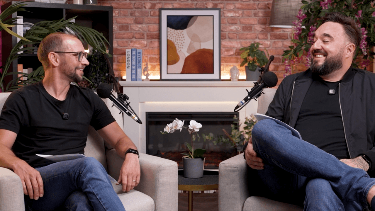 Two people in a podcast interview studio with microphones, during a Hello AI Collective conversation